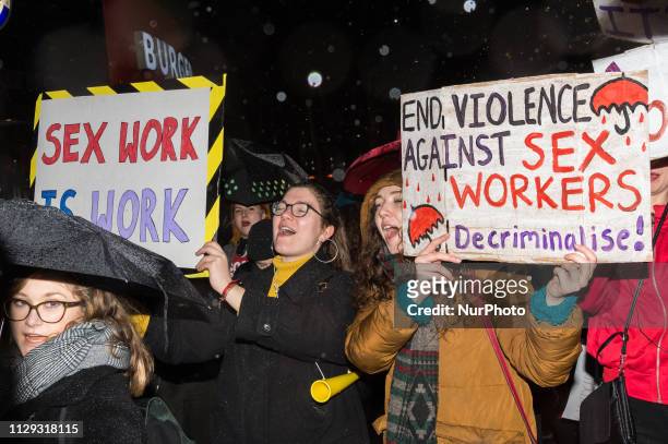 Hundreds of people take part in a protest against discrimination of sex workers held on International Women's Day at London's Leicester Square on 08...