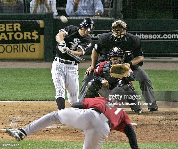 Chicago White Sox's Scott Podsednik hits a grand slam off the Houston Astros' Andy Pettitte in the fourth inning on Friday, June 23 at US Cellular in...