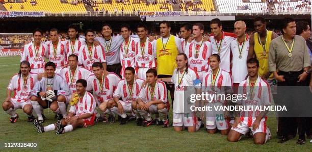 Mexico's team Necaxa poses with the World Club Championship third place medal 14 January after beating Real Madrid at Maracana Stadium in Rio de...