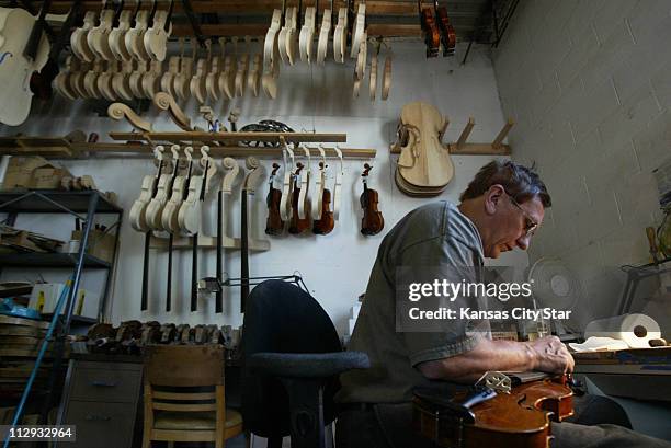 Vladimir Logashov worked on the bridge of an instrument recently at K.C. Strings in Merriam. The best tone woods are becoming unavailable or...