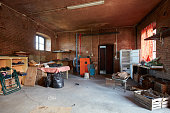 Messy basement with red bricks walls in old country house