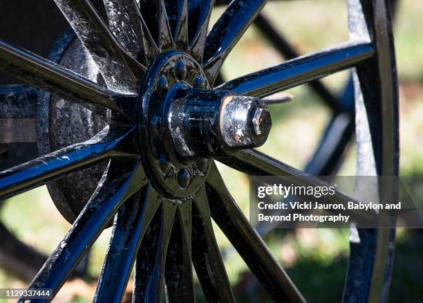 spokes on the wheel of horse and buggy in amish country, pennsylvania - amish buggy stock pictures, royalty-free photos & images