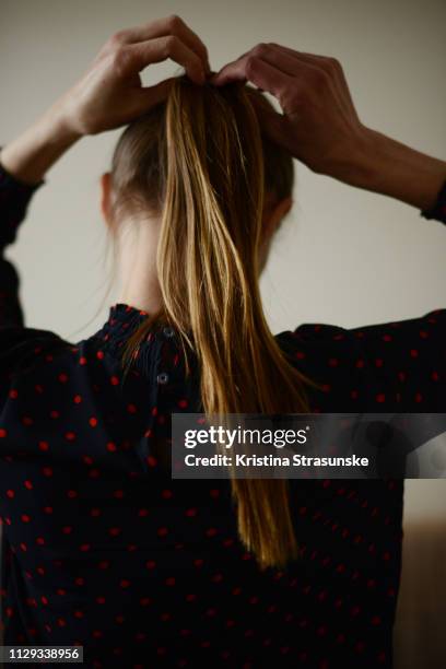 woman with long hair in a high ponytail - blouse back stock pictures, royalty-free photos & images