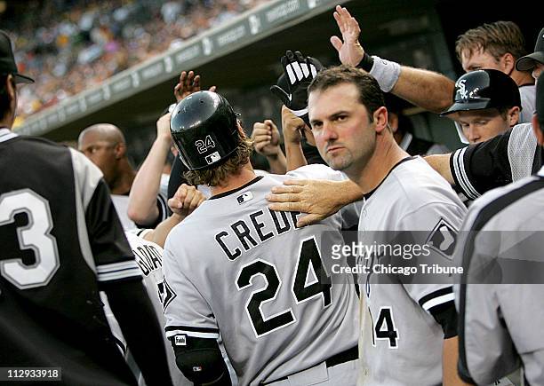 Chicago White Sox's players congratulates Joe Crede after he and Paul Konerko hit solo home runs. The White Sox defeated the Tigers 7-1 at Comerica...