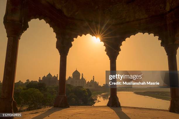 amazing sunset over taj mahal. - taj mahal palace stock pictures, royalty-free photos & images