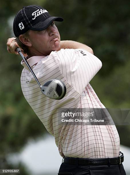 Lucas Glover watches his tee shot on the 18th hole in the first round of the Cialis Western Open on Thursday, July 6, 2006.
