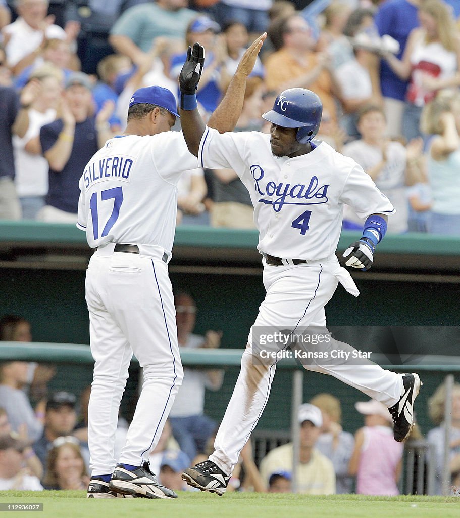 Kansas City Royals' Angel Berroa (4) is congratulated by thi