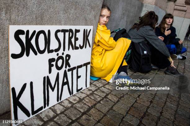 Fifteen year old Swedish student Greta Thunberg leads a school strike and sits outside of Riksdagen, the Swedish parliament building, in order to...