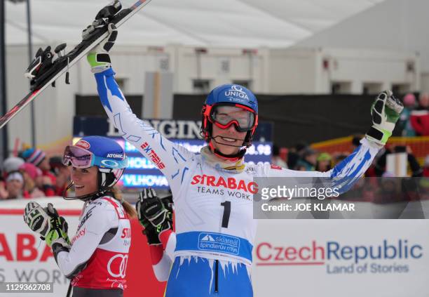 Mikaela Shiffrin of US and Slovakia's Petra Vlhova celebrate in the finish area after the women's slalom event at the FIS Ski World cup in Spindleruv...