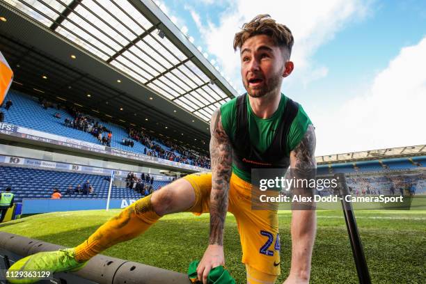 Preston North End's Sean Maguire climbs the advertising boards after the match to give his shirt to a fan during the Sky Bet Championship match...