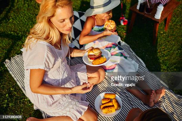 4th of july picnic - burger with flag stock pictures, royalty-free photos & images