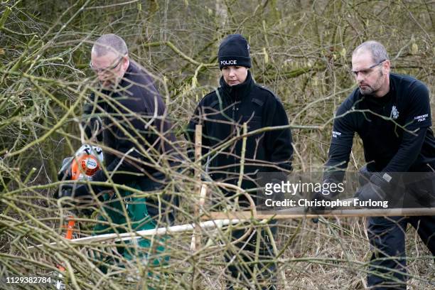 Police officers search dense undergrowth in Oak Road Park in Hull near to the home of missing 21-year-old student Libby Squire on February 13, 2019...