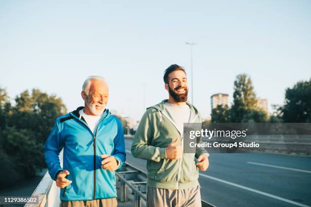 father and son - training period stock pictures, royalty-free photos & images