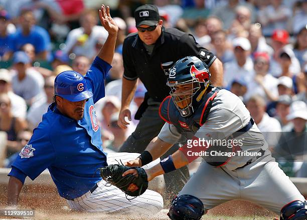 Chicago Cubs' Henry Blanco, left, slides safe at home plate on Todd Walker's single in the second inning against St. Louis Cardinals at Wrigley Field...