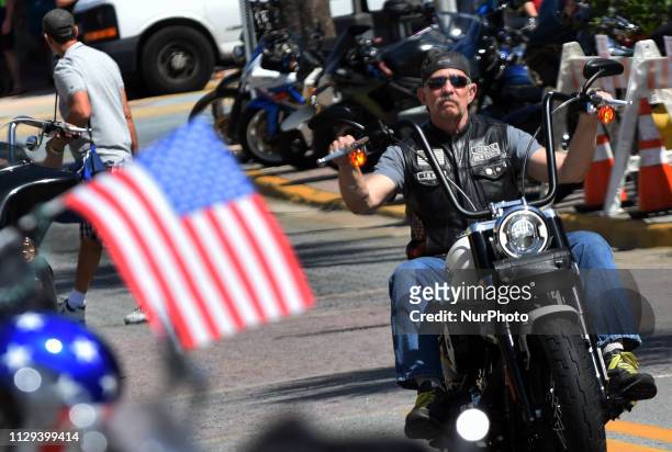 Motorcyclist parades down Main Street on March 8, 2019 for the opening day of Bike Week in Daytona Beach, Florida. The 10-day event, which draws...