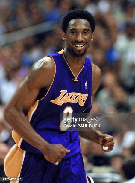 Kobe Bryant of the Los Angeles Lakers smiles after scoring two of his team high 28 points against the San Antonio Spurs during game two of their NBA...