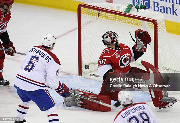 Carolina Hurricanes goalie Cam Ward gives up a goal to the Montreal Canadiens' Kyle Chipchura during the first period at the RBC Center in Raleigh,...