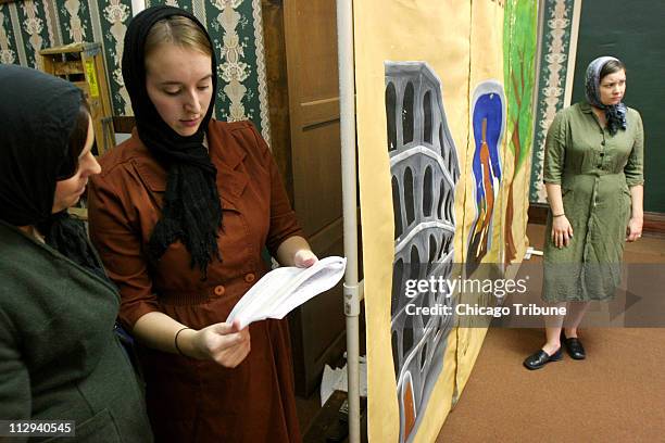 Megan Stewart-Felt, far right, portrays Irena Sendler as she rehearses with Jessica Ripper, left, and Sabrina Murphy during practice of their...