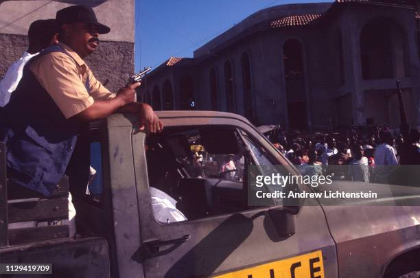 After United States troops have occupied Haiti and restored the nation's democratically elected president, Jean Bertrand Aristide, police make a rare...
