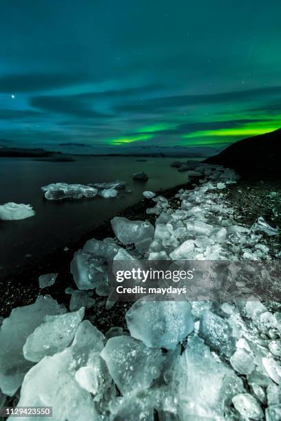 northern lights, iceland - evento catastrofico stock-fotos und bilder