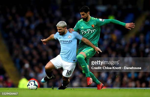 Sergio Aguero of Manchester City and Miguel Britos of Watford FC in action during the Premier League match between Manchester City and Watford FC at...
