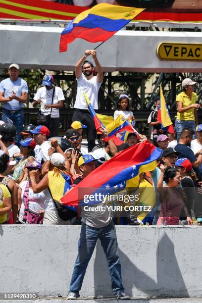 Supporters of Venezuelan opposition leader and self-proclaimed acting president Juan Guaido, demonstrate in Caracas on March 9, 2019. - Thousands of...