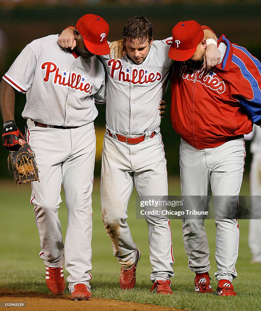 Philadelphia Phillies right fielder Aaron Rowand is helped off the News  Photo - Getty Images