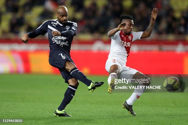 Bordeaux's French forward Jimmy Briand vies for the ball with Monaco's Portuguese forward Gelson Martins during the French L1 football match between...