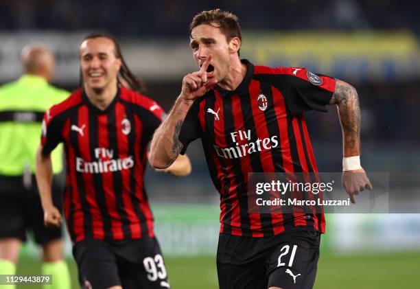 Lucas Biglia of AC Milan celebrates after scoring the opening goa during the Serie A match between Chievo Verona and AC Milan at Stadio Marc'Antonio...