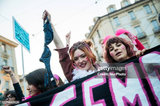 Young woman show her bra when she take part to a demonstration against gender violence and calling for gender parity Turin, Italy on 8 March 2019.