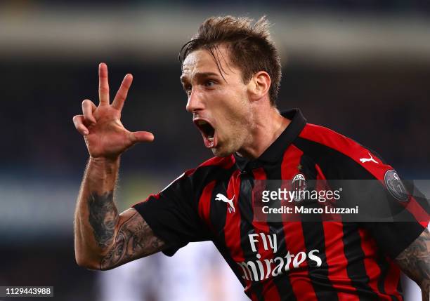 Lucas Biglia of AC Milan celebrates after scoring the opening goa during the Serie A match between Chievo Verona and AC Milan at Stadio Marc'Antonio...