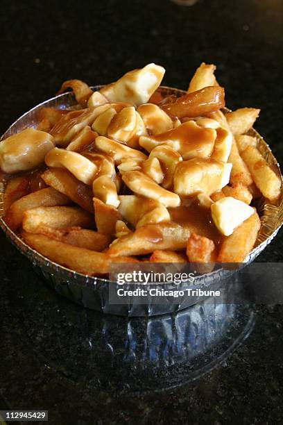 Poutine Origin 1,375 Poutine Stock Photos, High-Res Pictures, and Images - Getty Images