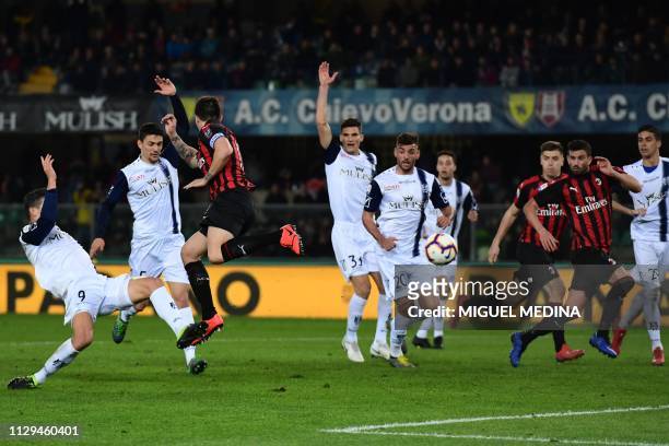 Milan's Italian defender Alessio Romagnoli attempts to score with a heel kick during the Italian Serie A football match Chievo Verona vs AC Milan on...