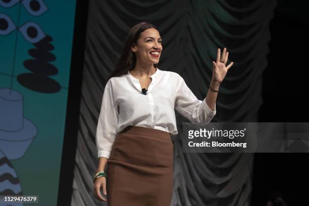 Representative Alexandria Ocasio-Cortez, a Democrat from New York, waves during the South By Southwest conference in Austin, Texas, U.S., on...