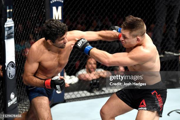 Beneil Dariush punches Drew Dober in their lightweight bout during the UFC Fight Night event at Intrust Bank Arena on March 9, 2019 in Wichita,...