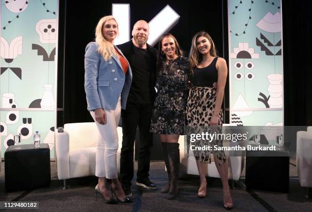Charlotte Flair, Paul Michael Levesque aka 'Triple H', Stephanie McMahon, and Cathy Kelley pose onstage at Featured Session: The Womens Evolution in...