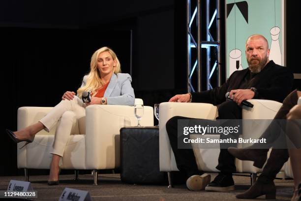 Charlotte Flair and Paul Michael Levesque aka 'Triple H' speak onstage at Featured Session: The Womens Evolution in WWE and Beyond during the 2019...