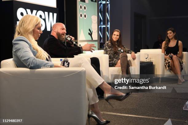 Charlotte Flair, Paul Michael Levesque aka 'Triple H', Stephanie McMahon, and Cathy Kelley speak onstage at Featured Session: The Womens Evolution...
