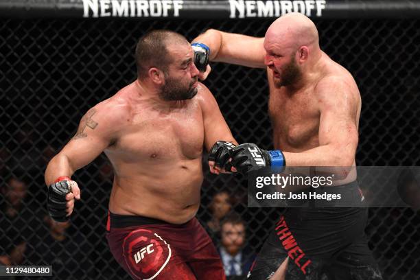 Ben Rothwell punches Blagoy Ivanov of Bulgaria in their heavyweight bout during the UFC Fight Night event at Intrust Bank Arena on March 9, 2019 in...