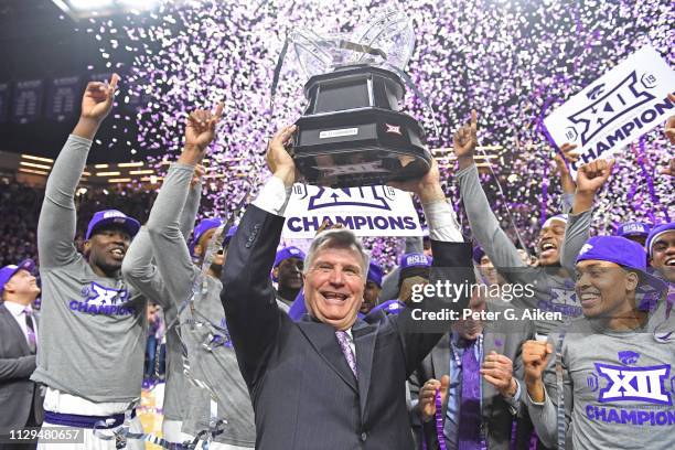 Head coach Bruce Weber of the Kansas State Wildcats and his players celebrate after wining the Big 12 Regular Season Championship on March 9, 2019 at...