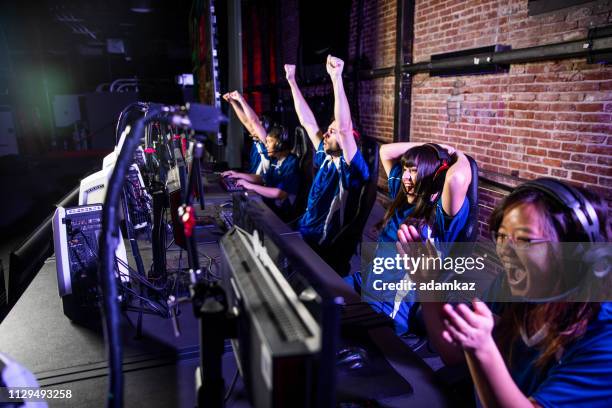 esports team winning the match - gaming championship stock pictures, royalty-free photos & images