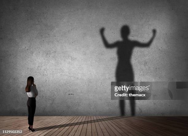 businesswoman powerful of shadow - strength stock pictures, royalty-free photos & images
