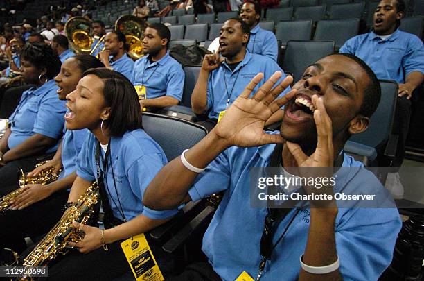 Saxophone players Christina Jones and Jeremy Floyd with the Livingstone College Pep Band cheer on their basketball team as they Livingstone take on...