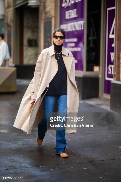 Leandra Medine is seen wearing trench coat, black turtleneck outside Michael Kors during New York Fashion Week Autumn Winter 2019 on February 13,...