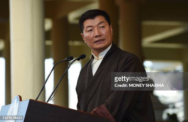 Prime Minister of the Tibetan government in exile, Lobsang Sangay looks on as he address the gathering at the Dalai Lama's temple during the 60th...
