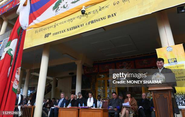 Prime Minister of the Tibetan government in exile Lobsang Sangay addresses the gathering at the Dalai Lama's temple during the 60th anniversary of...