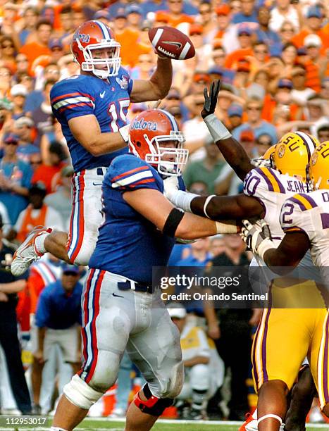 Florida quaterback Tim Tebow leaps to throw a pass over his offensive line for a touchdown in the second half against Louisiana State at Ben Hill...