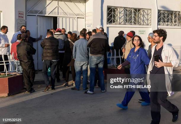 Family members of 11 Tunisian newborns, who died suddenly while at the Rabta neonatal clinic of the Wassila Bourguiba state maternity hospital, stand...