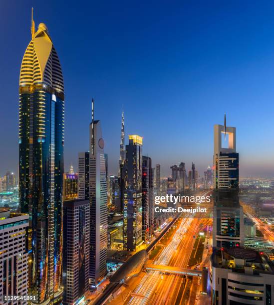 downtown dubai city skyline at sunset, united arab emirates. - arial view dubai skyline stock pictures, royalty-free photos & images