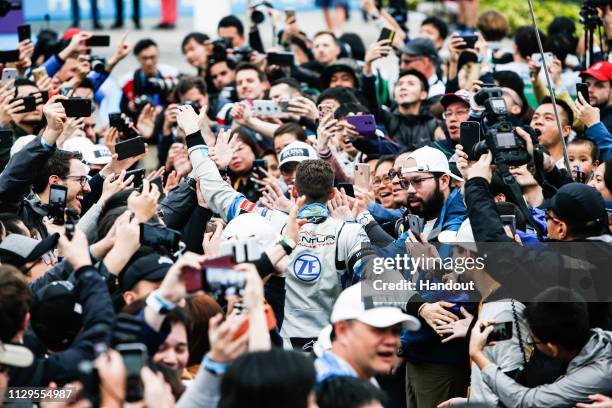 Edoardo Mortara Venturi Formula E makes his way through the crowd towards the podium on March 10, 2019 in Hong Kong, Hong Kong.